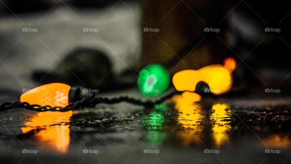 Icy pavement and warm lights.