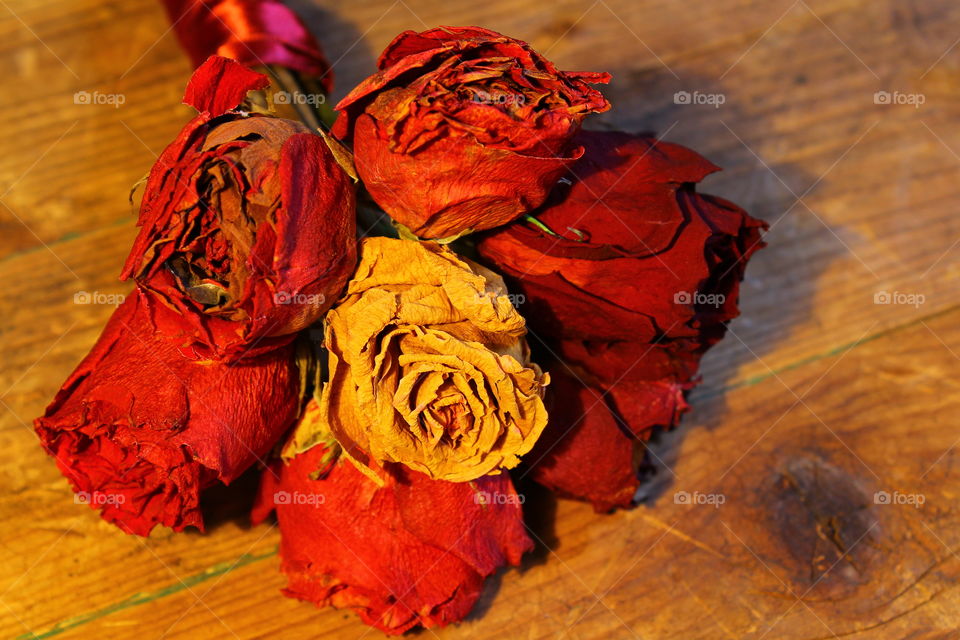 roses on wooden table