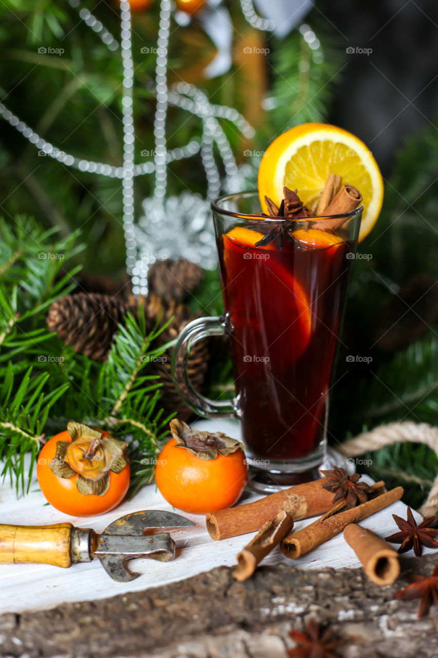 mulled wine and branches of a christmas tree