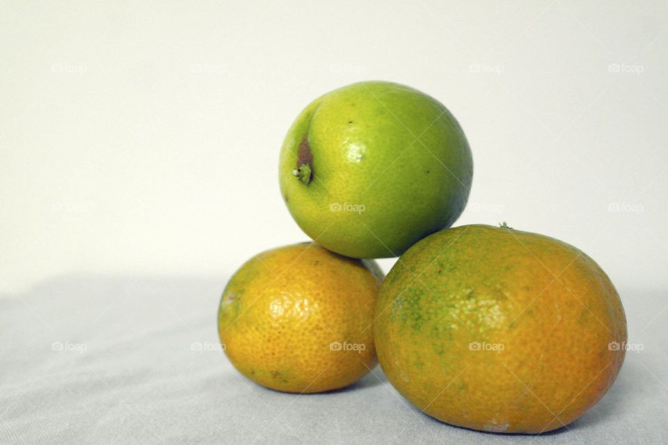 Two oranges and a lime