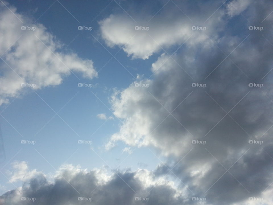 blue sky through the dark clouds