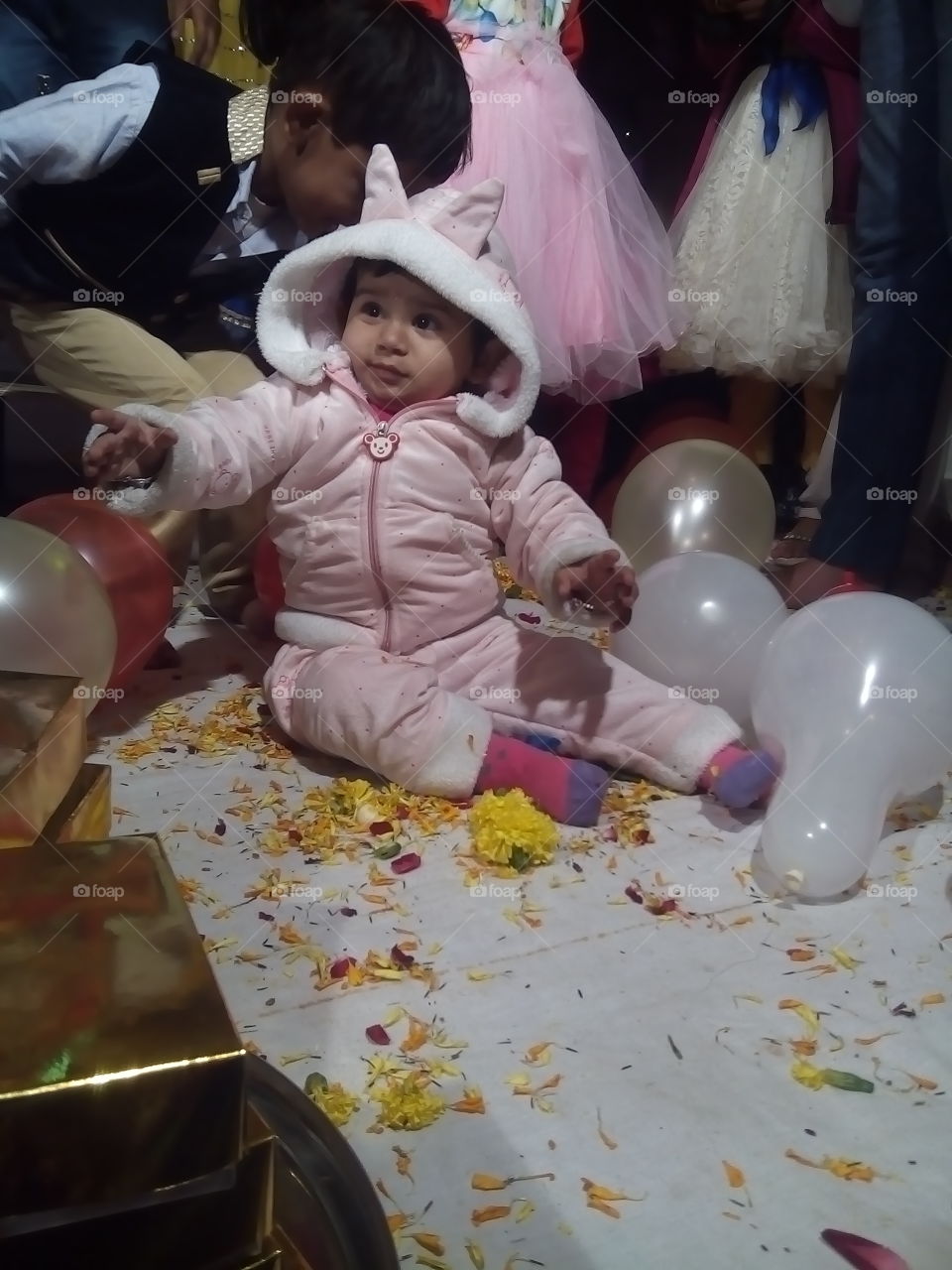 curious baby enjoying party