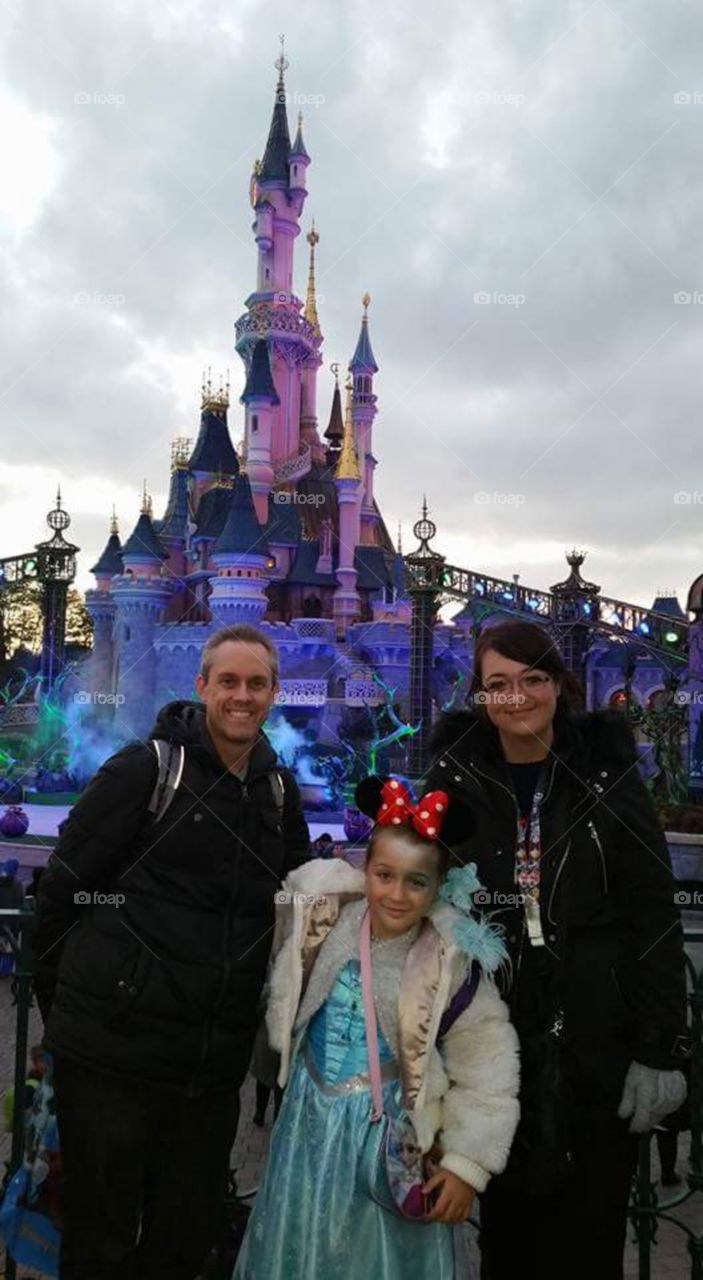 Disney world castle. family photo