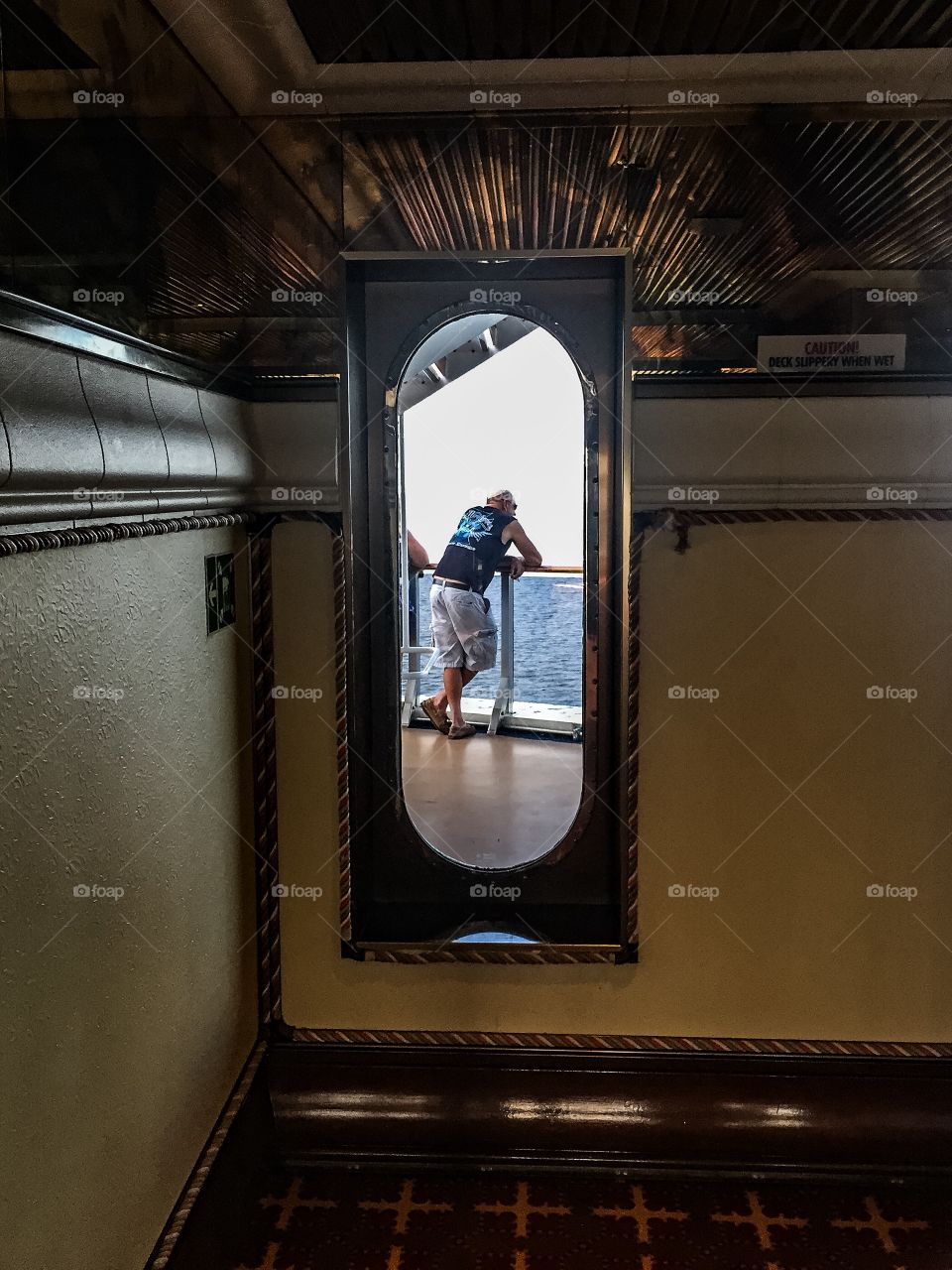 Man in a ship door