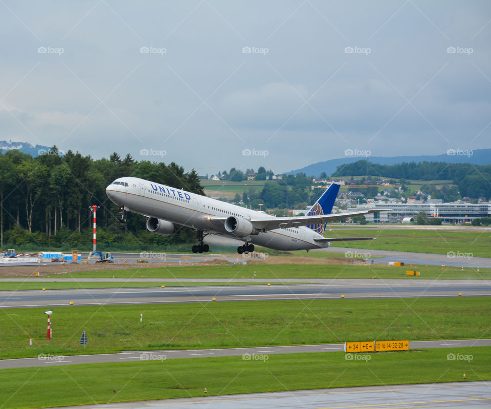 United Boeing 767-300 taking off from Zurich on a rainyday