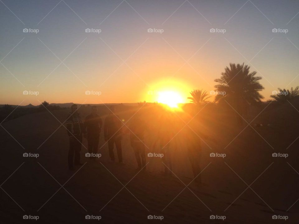 amazing sunset in desert on sand dunes