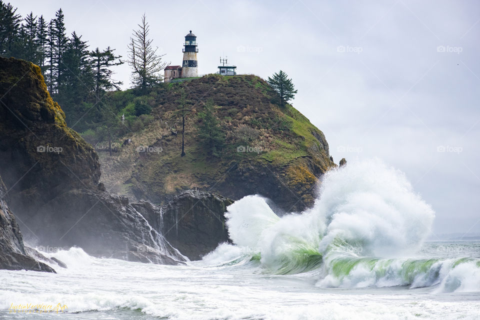 Waves crashing in front of the Cape Disappointment light house in Ilwaco, Wa.