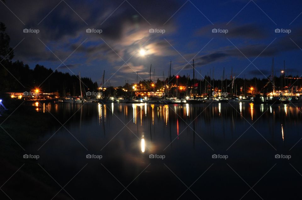 Harbor at Ucluelet, British Columbia, Canada, at night under the moon