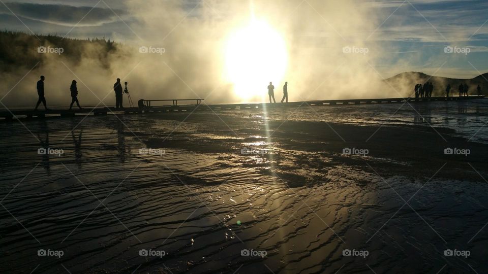 hot spring bridge silhouette as the sun is going down in Yellowstone national park