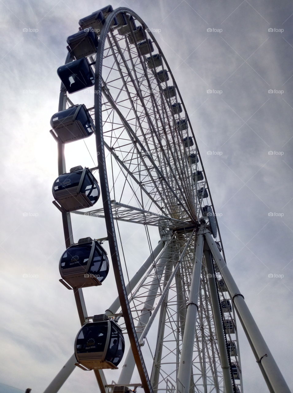 Ferris wheel and a bit cloudy sky in Seattle