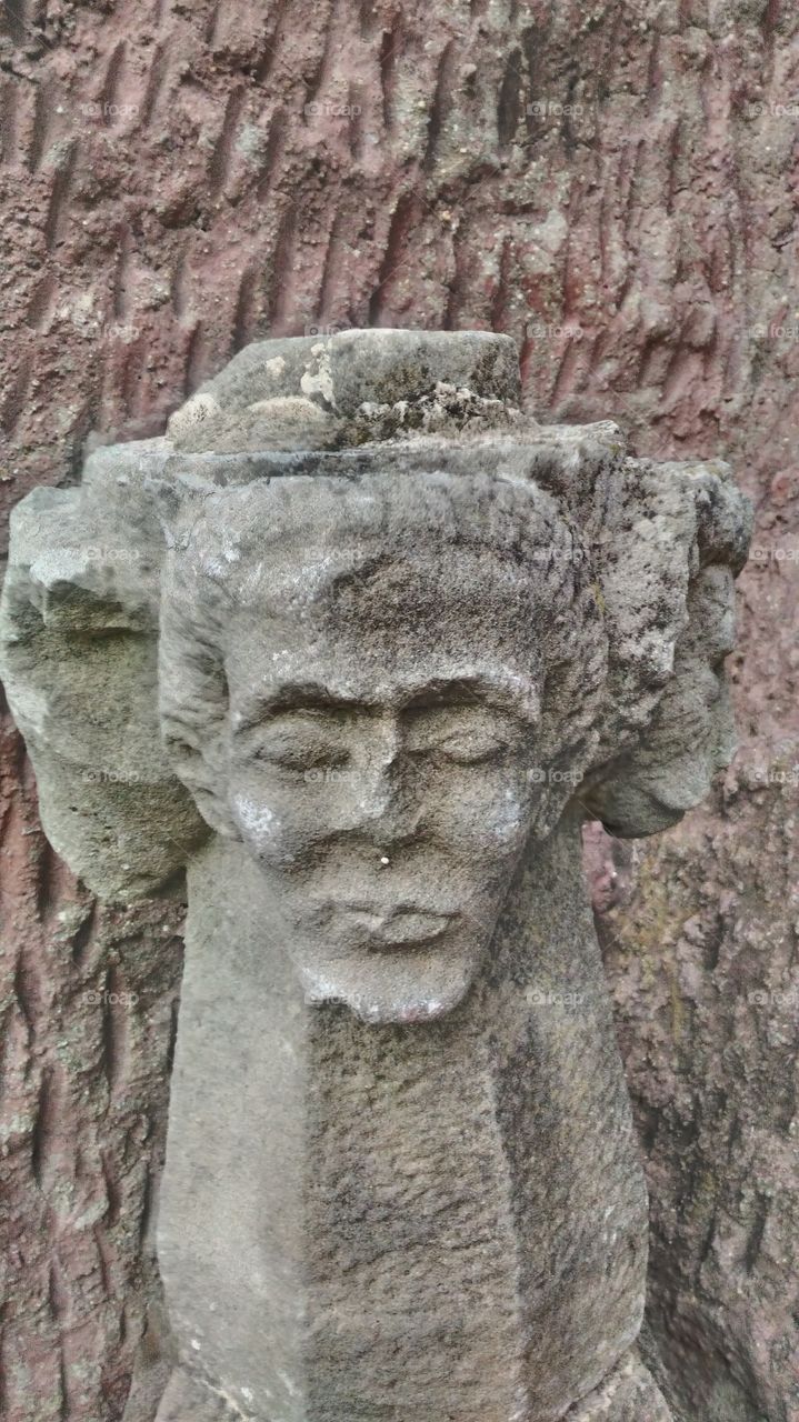 Multi face statue