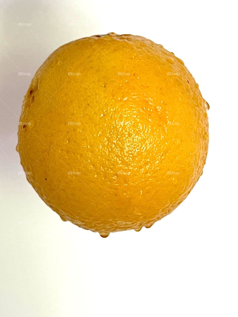 Big orange shot on a white background