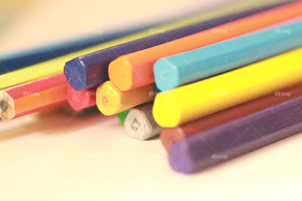 Colourful pencils in symmetry