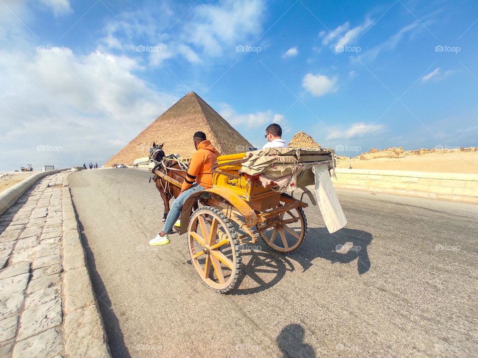 cabriolet with a hourse take tour at Pyramids