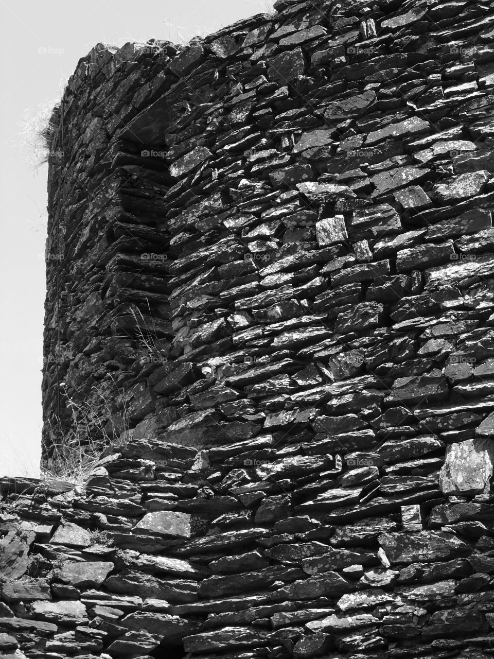 Detailed old historic walls surrounding a fortress in Luxembourg on a sunny summer day. 