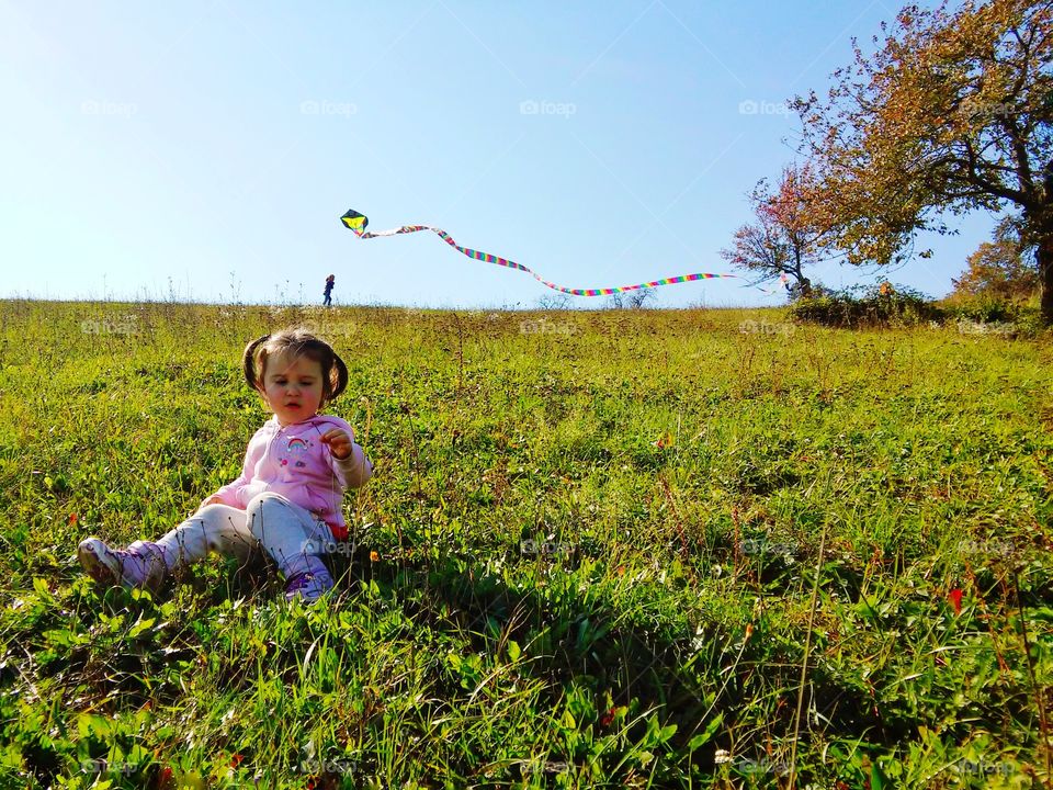 Baby on a field in autumn