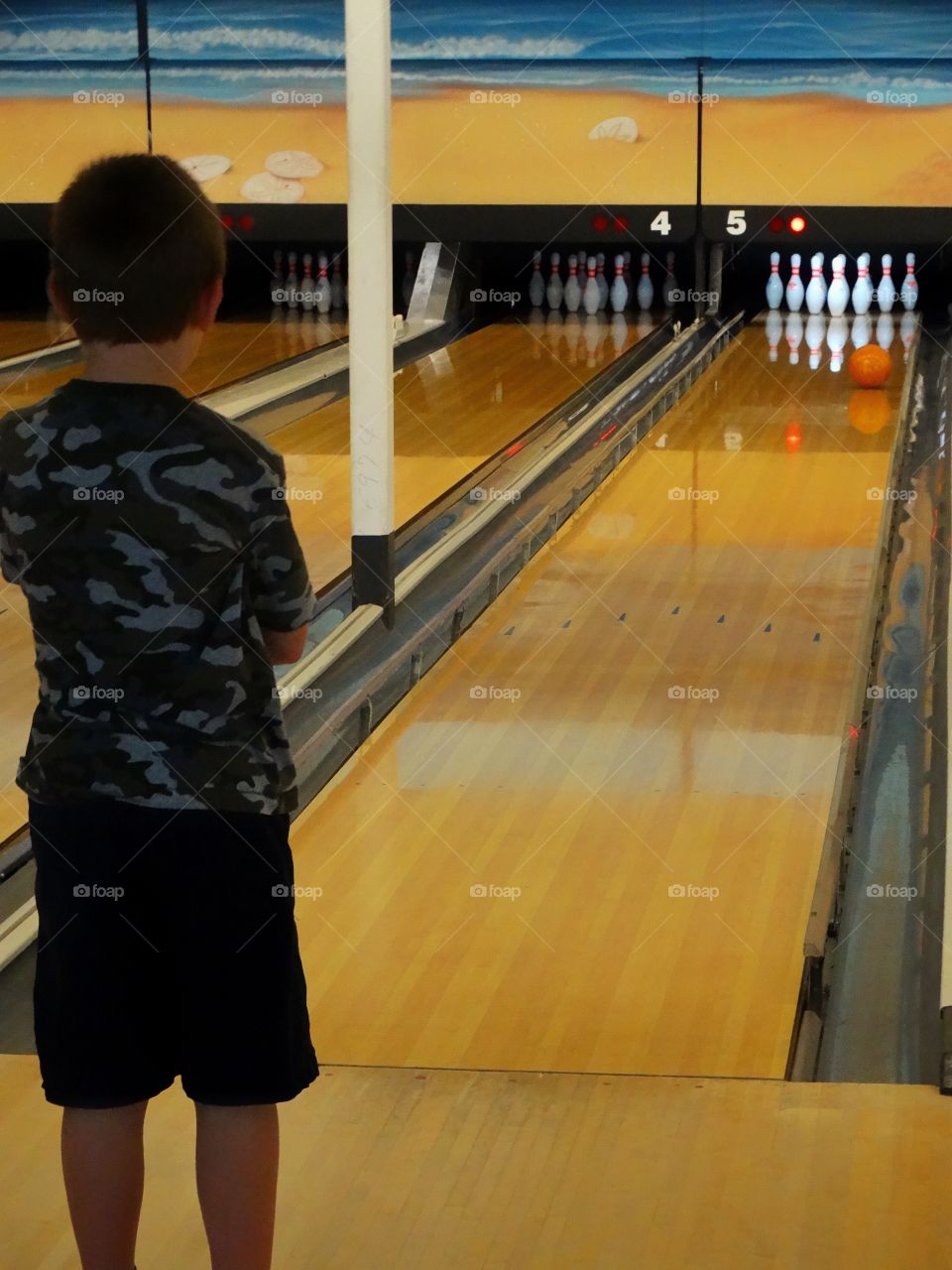 Boy In Bowling Alley
