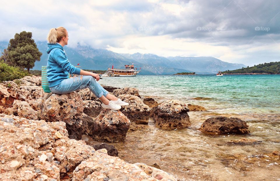 Resting girl on the beach