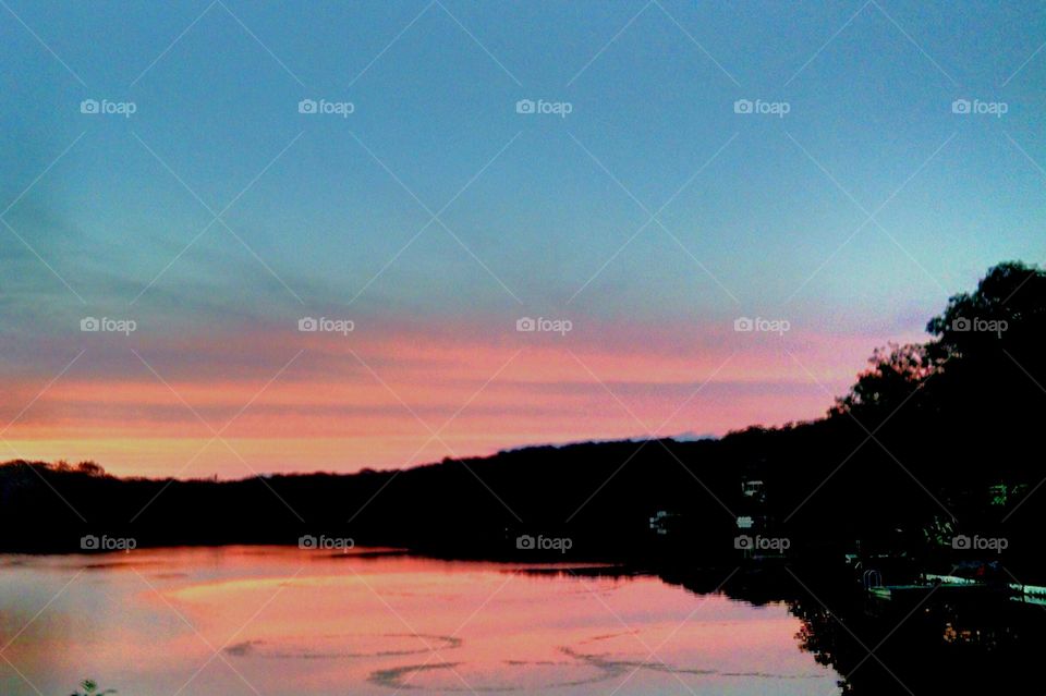 Sunset at Bear Pond. Driving on a country road during dusk