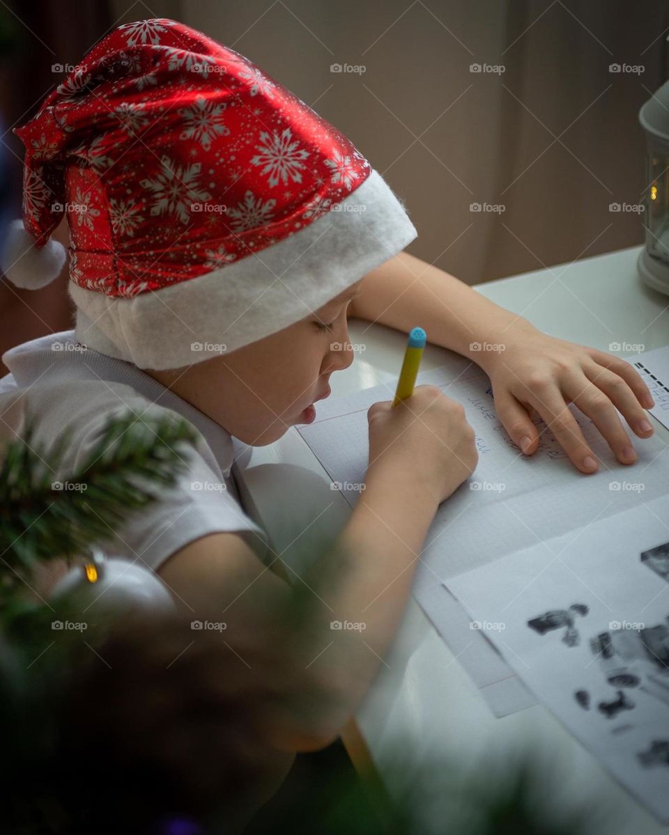 Baby boy writes a letter to Santa Claus, happy new year