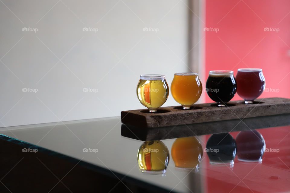 Beer glasses reflecting on a tabletop 