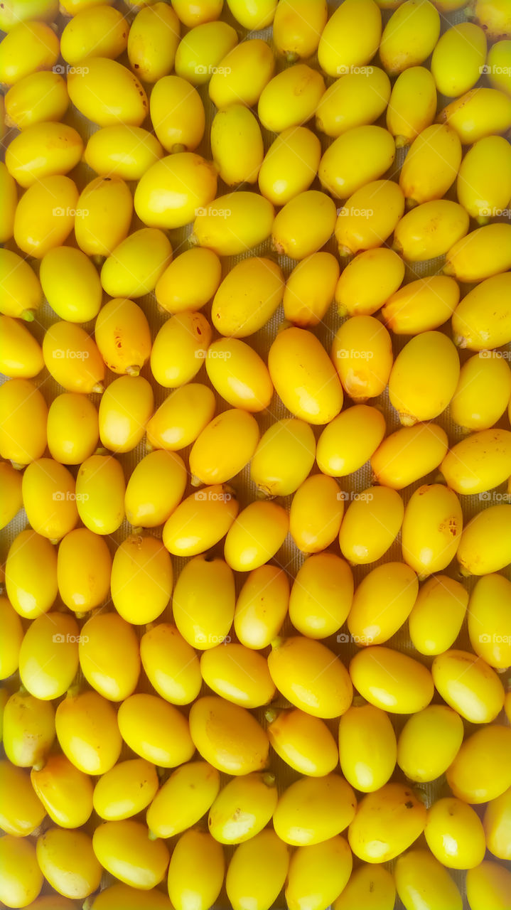 top view full frame of yellow Neem fruits