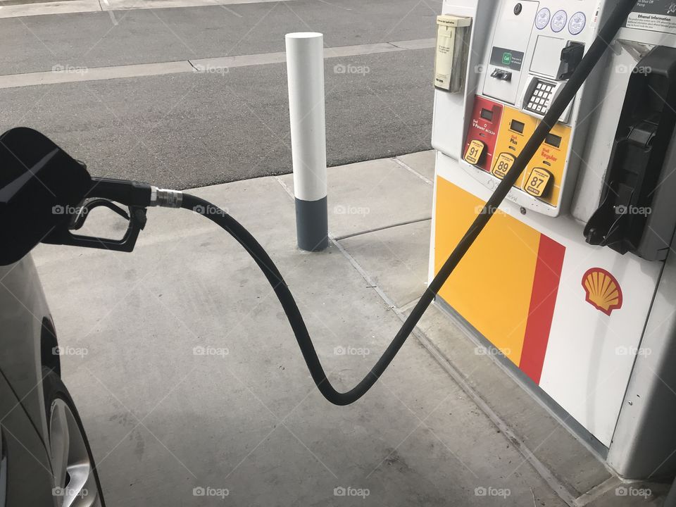 Filling up the car with fuel from the gas station - shell gas station gas 