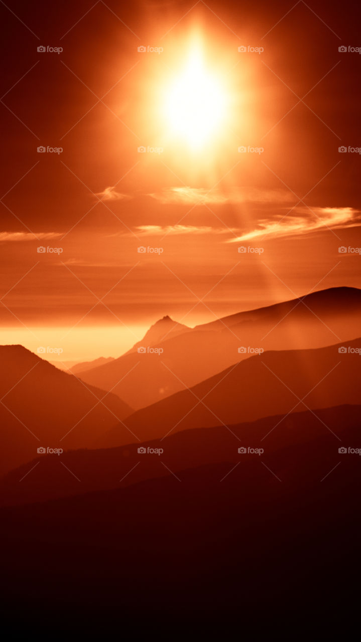 An inspiring red mountain landscape. Tatry mountains in Slovakia. A beautiful wallpaper for smartphone screen. Red abstract gradient with perspective.