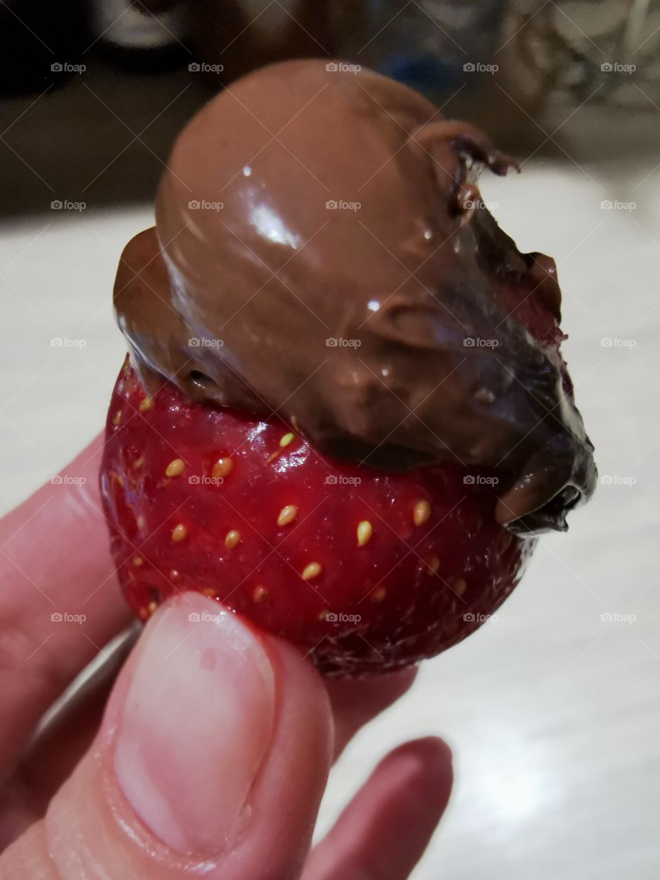 Sweet home indoor food yummy served table day part red form circle ellipce tasty hand strawberry view chocolade