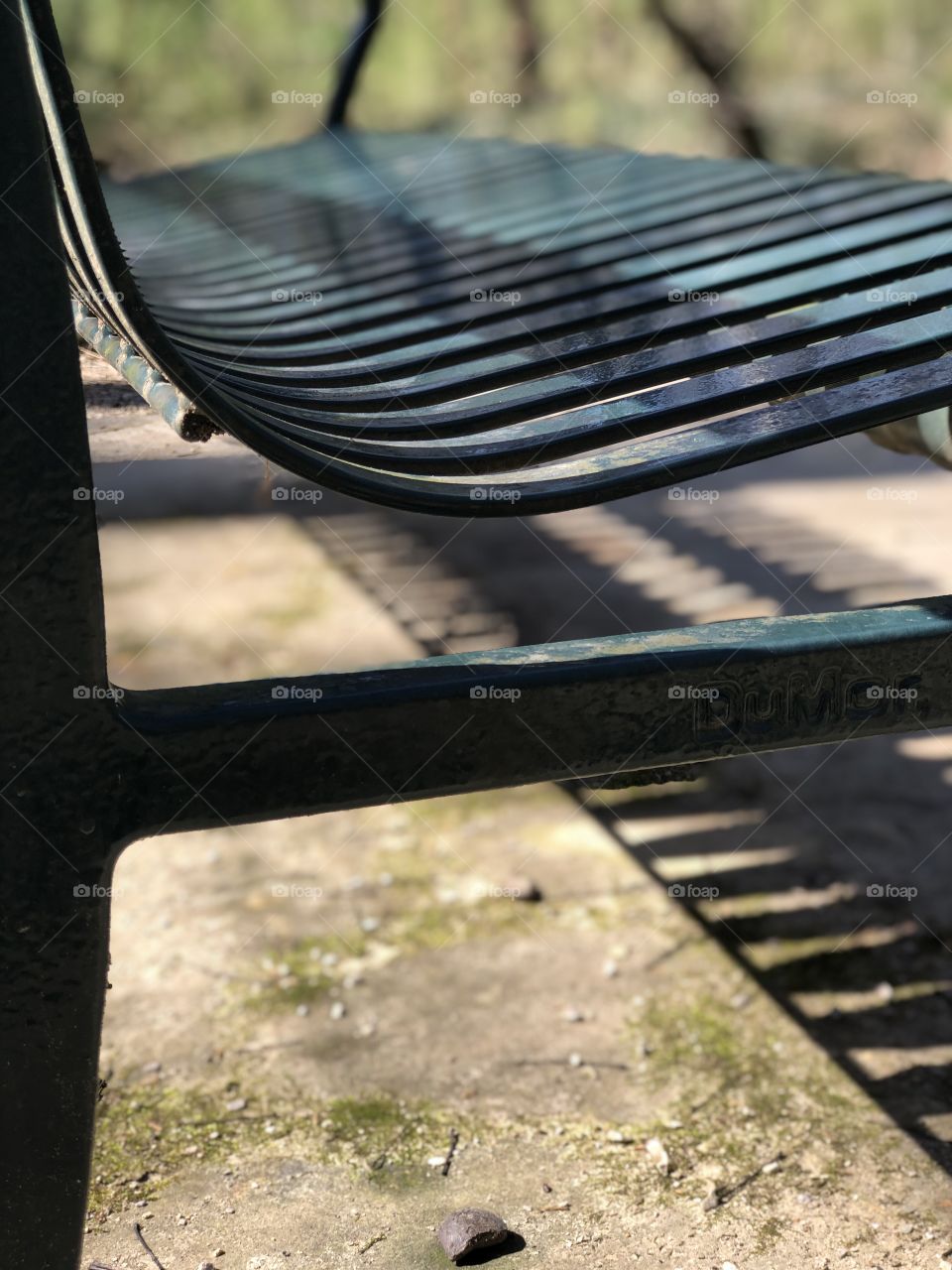 Green metal park bench 