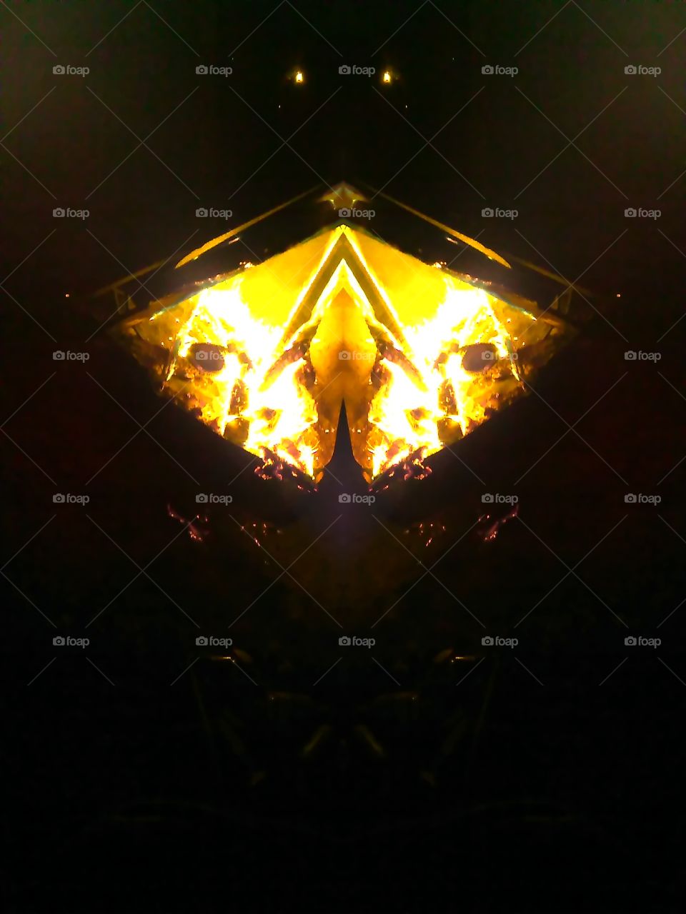 I took this photo at one of our bonfires with a mirror image setting on my phone and this is very cool and unique looking.