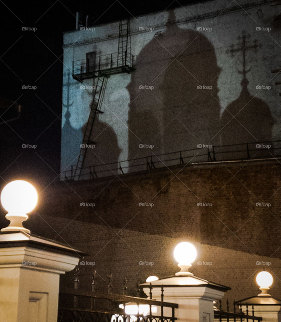 Russia Moscow.  Autumn evening.  Shadow of the domes of the Orthodox Church on a brick wall