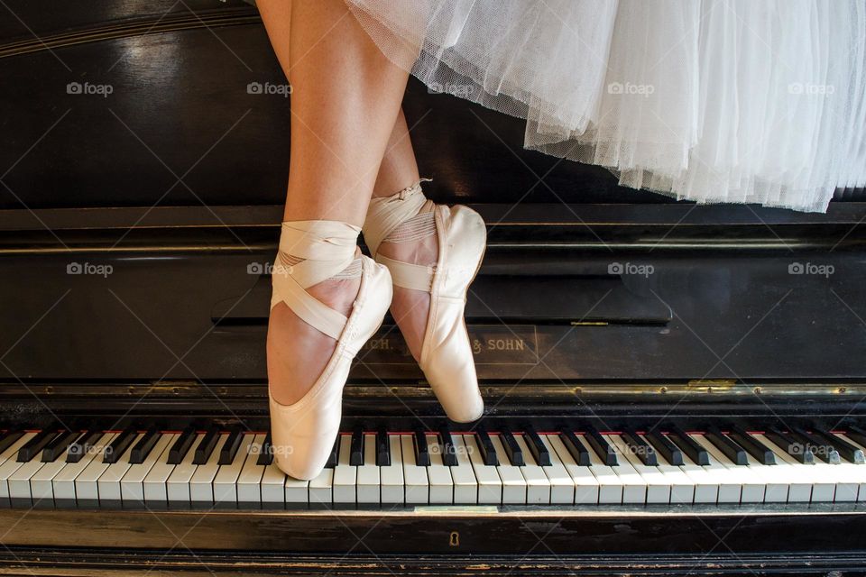 Ballerina Standing on A Piano