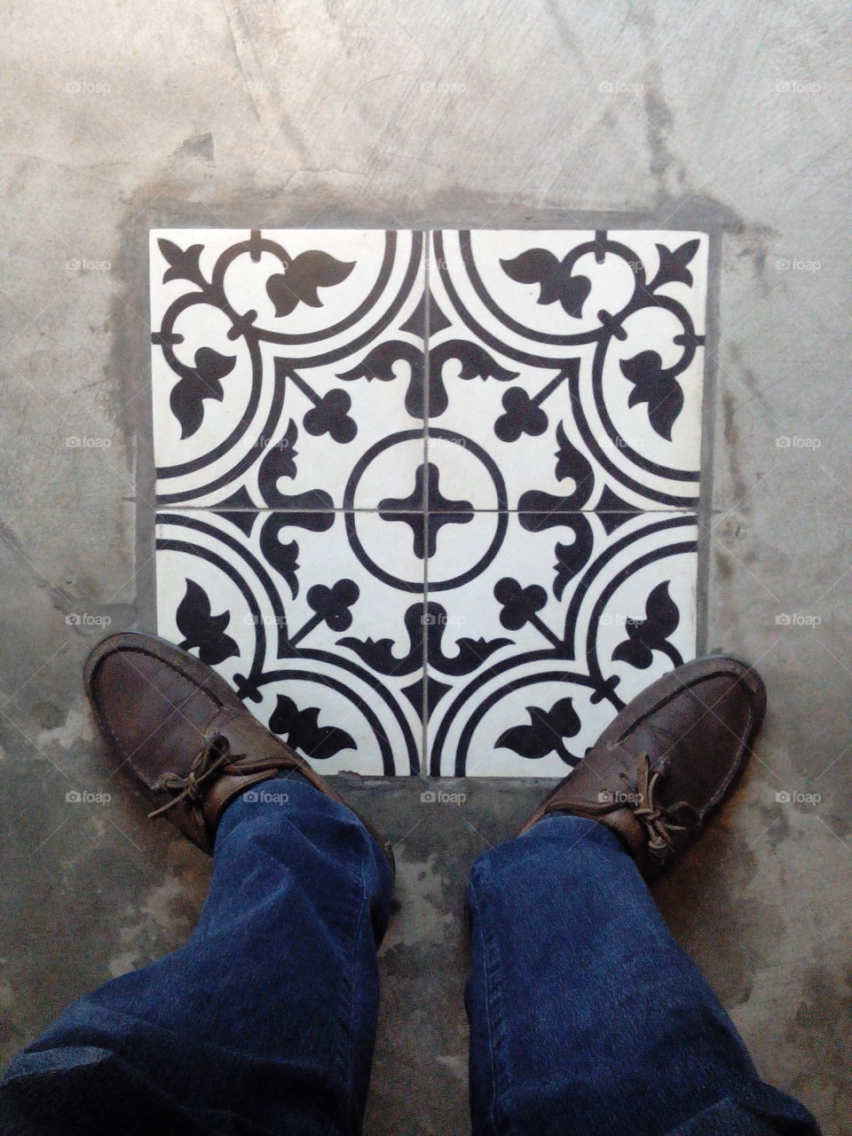 foot view on floor tile