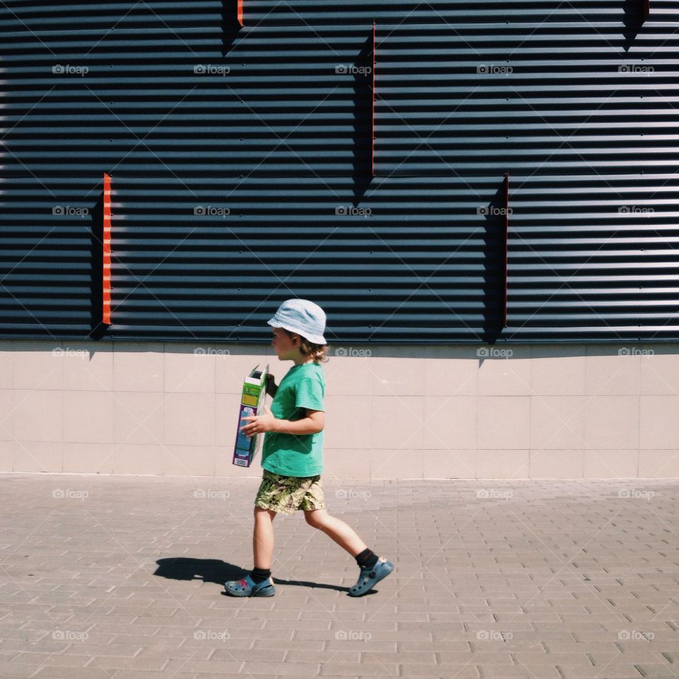 Kid crossing on the street 