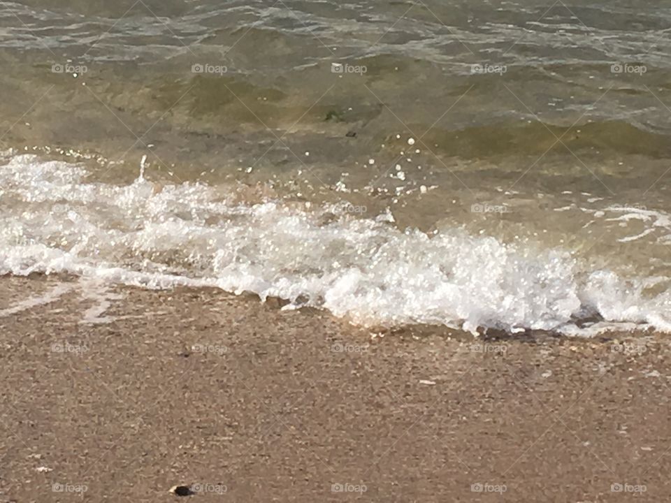 Waves crashing on the beach.