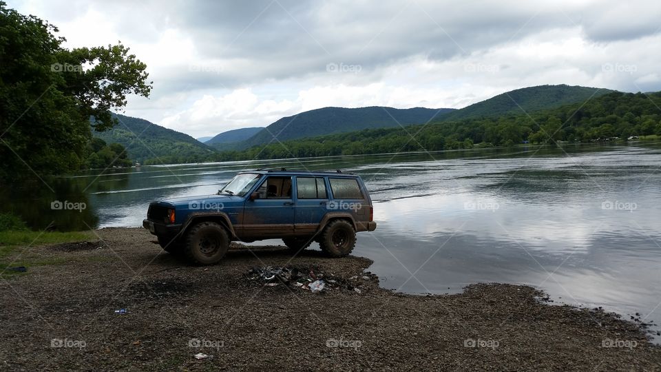 jeep by the river