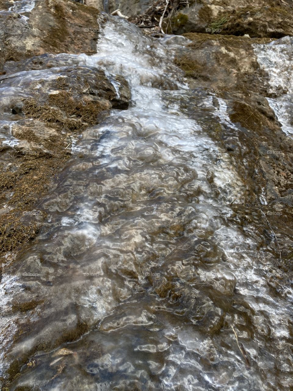 Frozen water falling down a rock face