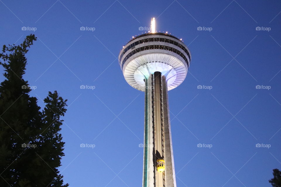 Riding up on the elevator on the outside of The Skylon Tower in Niagara Falls to reach the top to view both the American Falls, New York, and the larger Horseshoe Falls, Canada