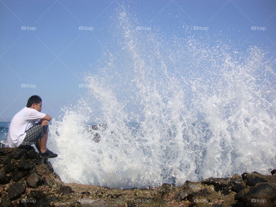 Sports run up on the beach the big waves with selfie malimbu senggigi Lombok Barat NTB Indonesia