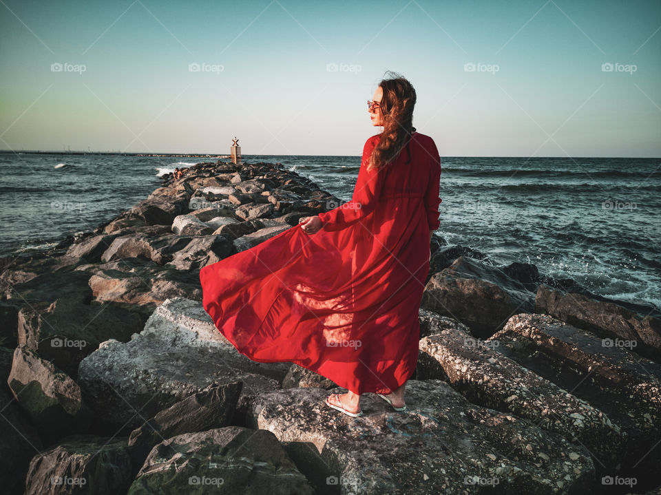 Red dress at the sea