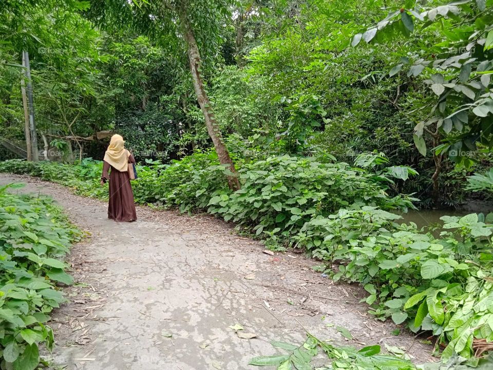 Village road walking a girl