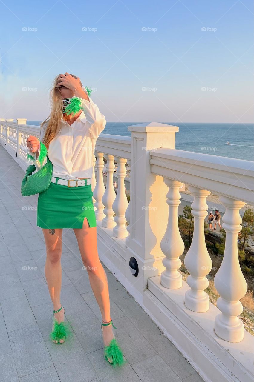 woman fashionably dressed on the beach