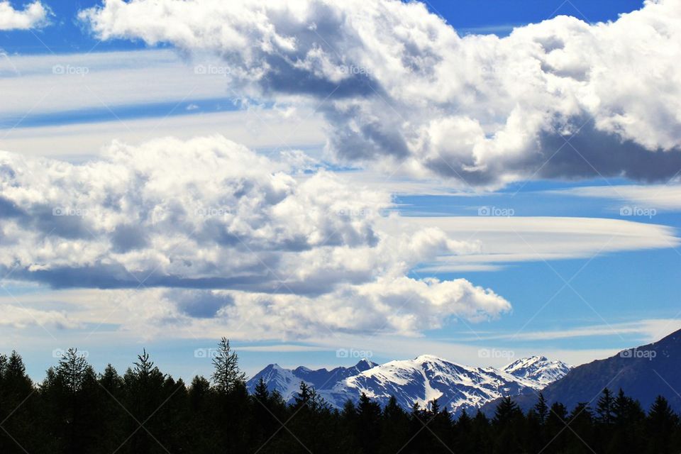 Clouds over the snowy mountains