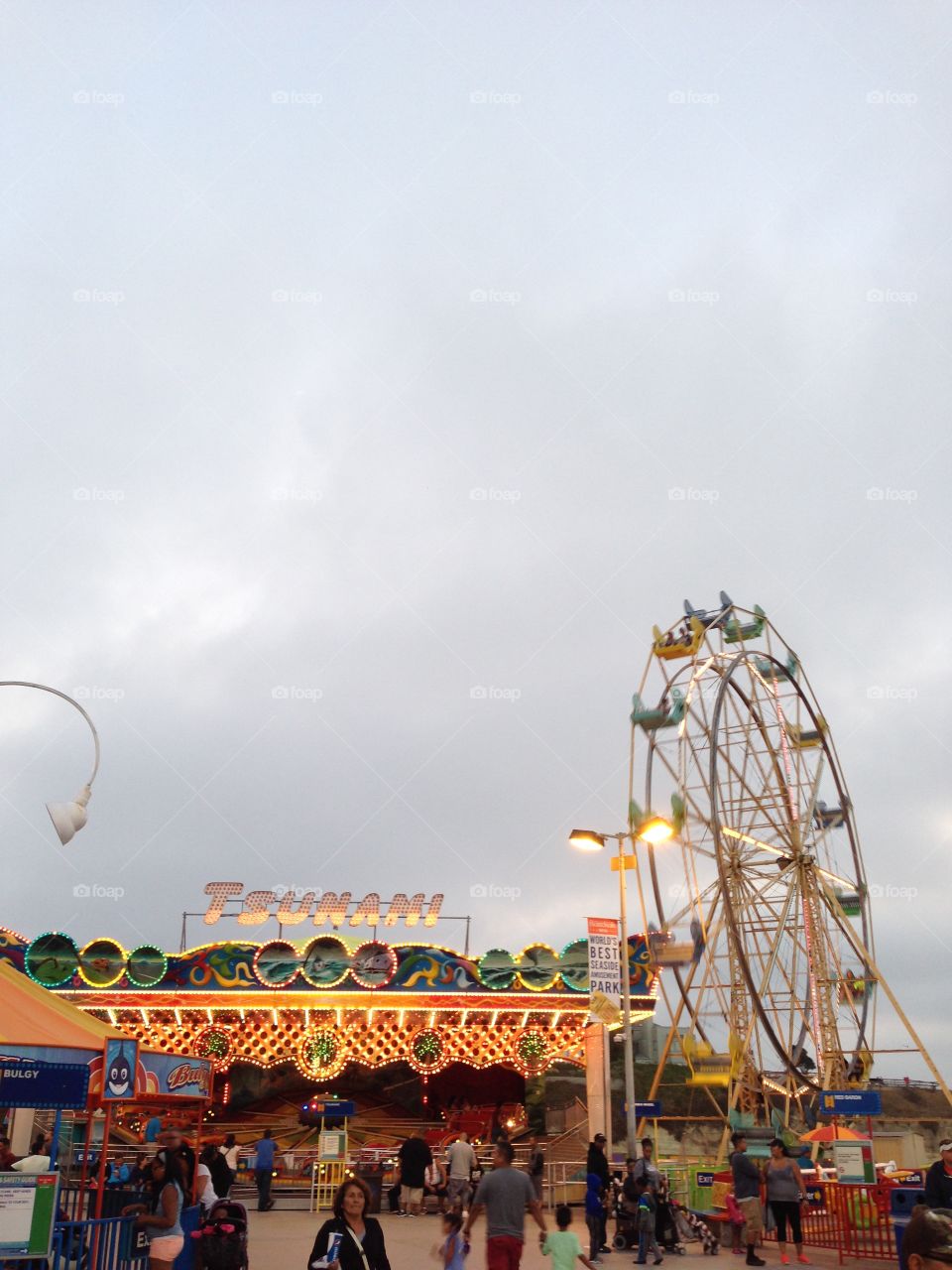 Ferris wheel and thunder rides in Santa Cruz boardwalk in California