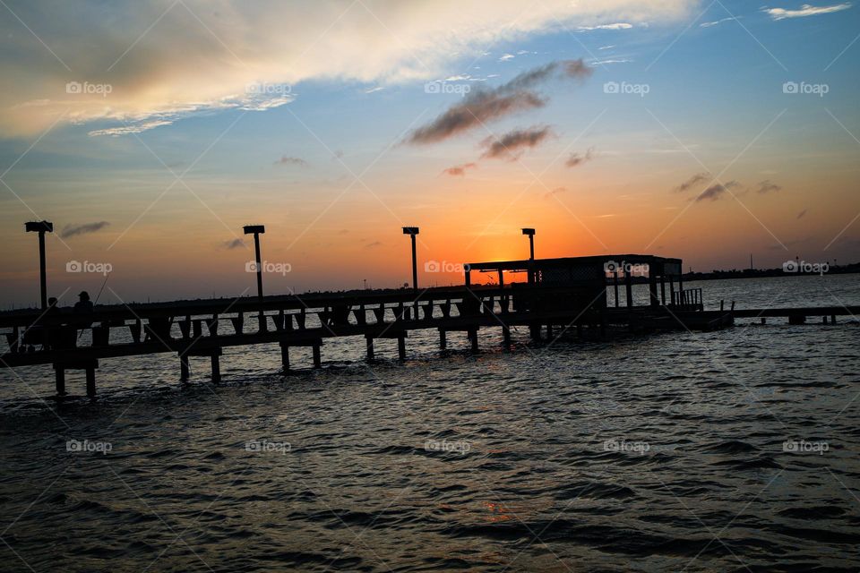 Fishing as the sun sets