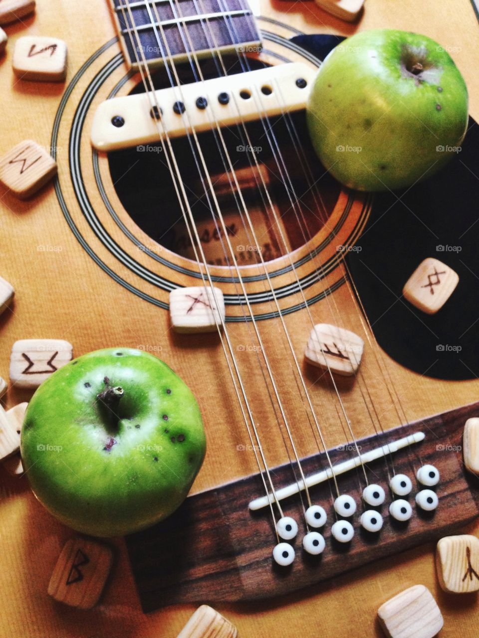 Tasty things... . Apples and runes on the guitar 
