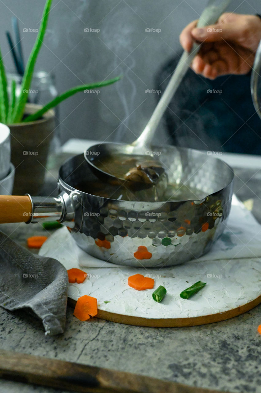 Soup mixing , mushroom soup , This is shout to autumn and call to winters , vegetable mushroom soup , steam, water , action shot 