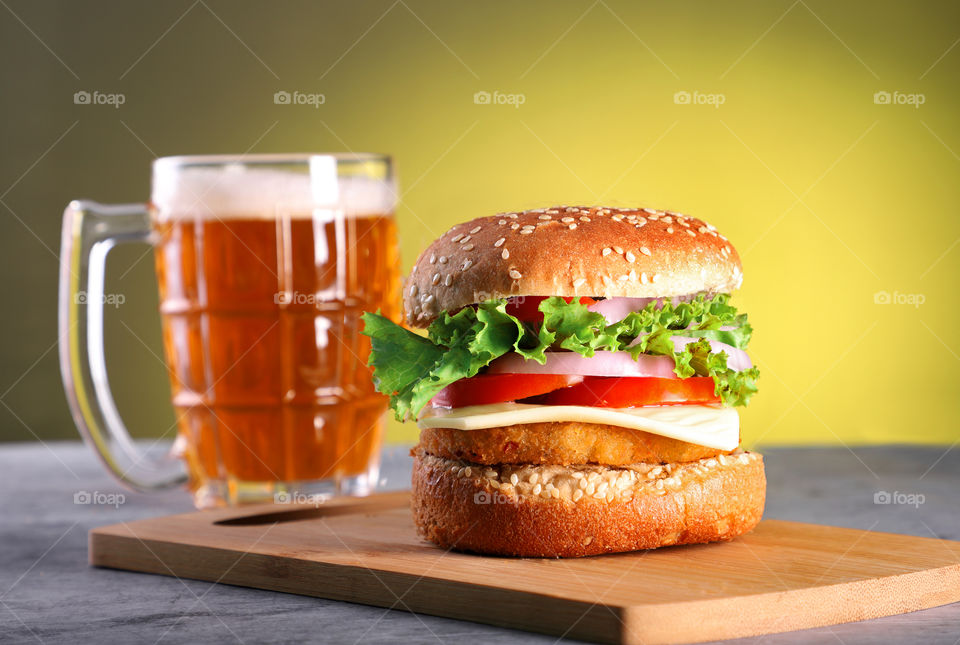 Vegetable / chicken burger with beer mug