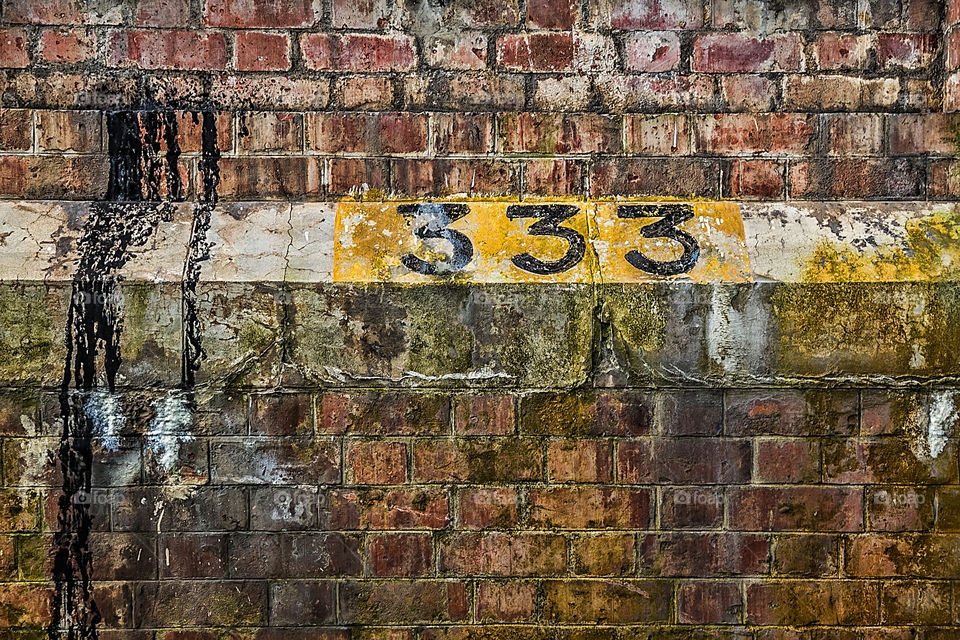 Number 333 on brick wall